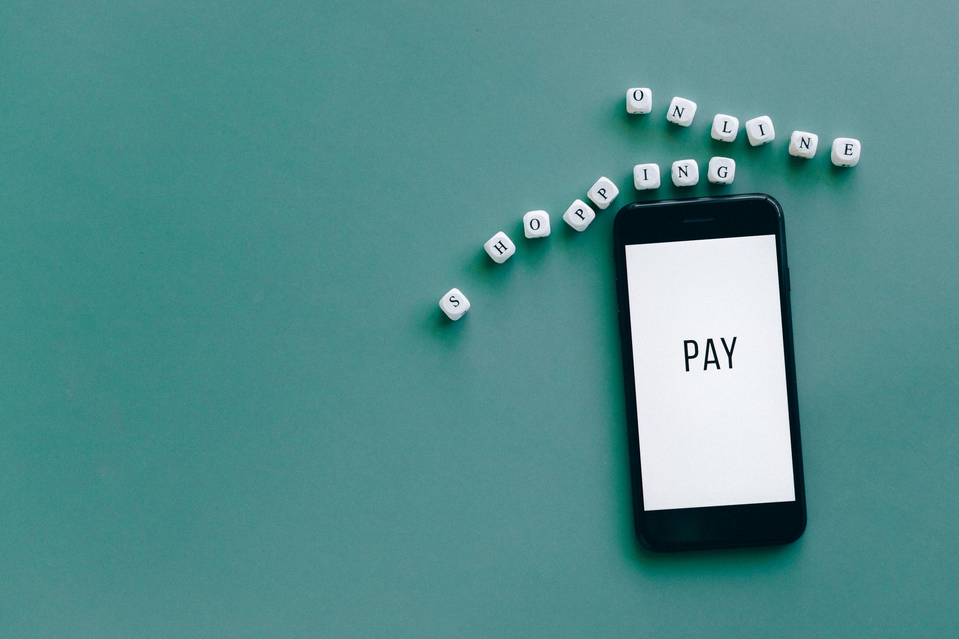 Image of smartphone displaying 'PAY' surrounded by dice spel