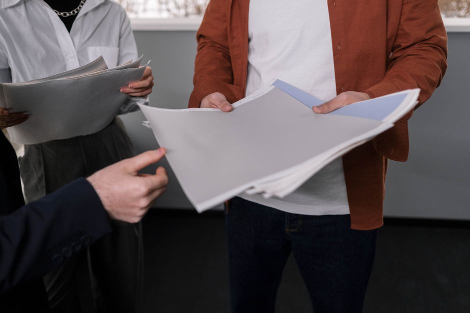 Business professionals discussing interior design samples du