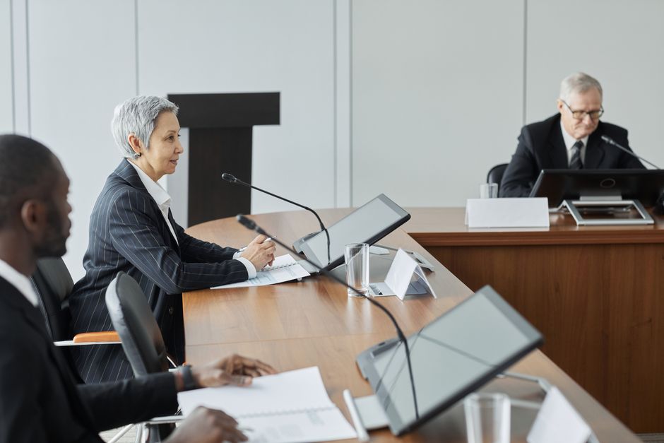 Executives in a conference room engaging in a professional b