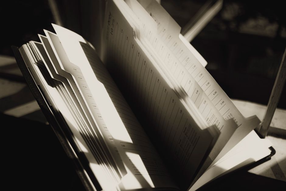 Shiny pages of agenda with lines and shadows on sunny day on