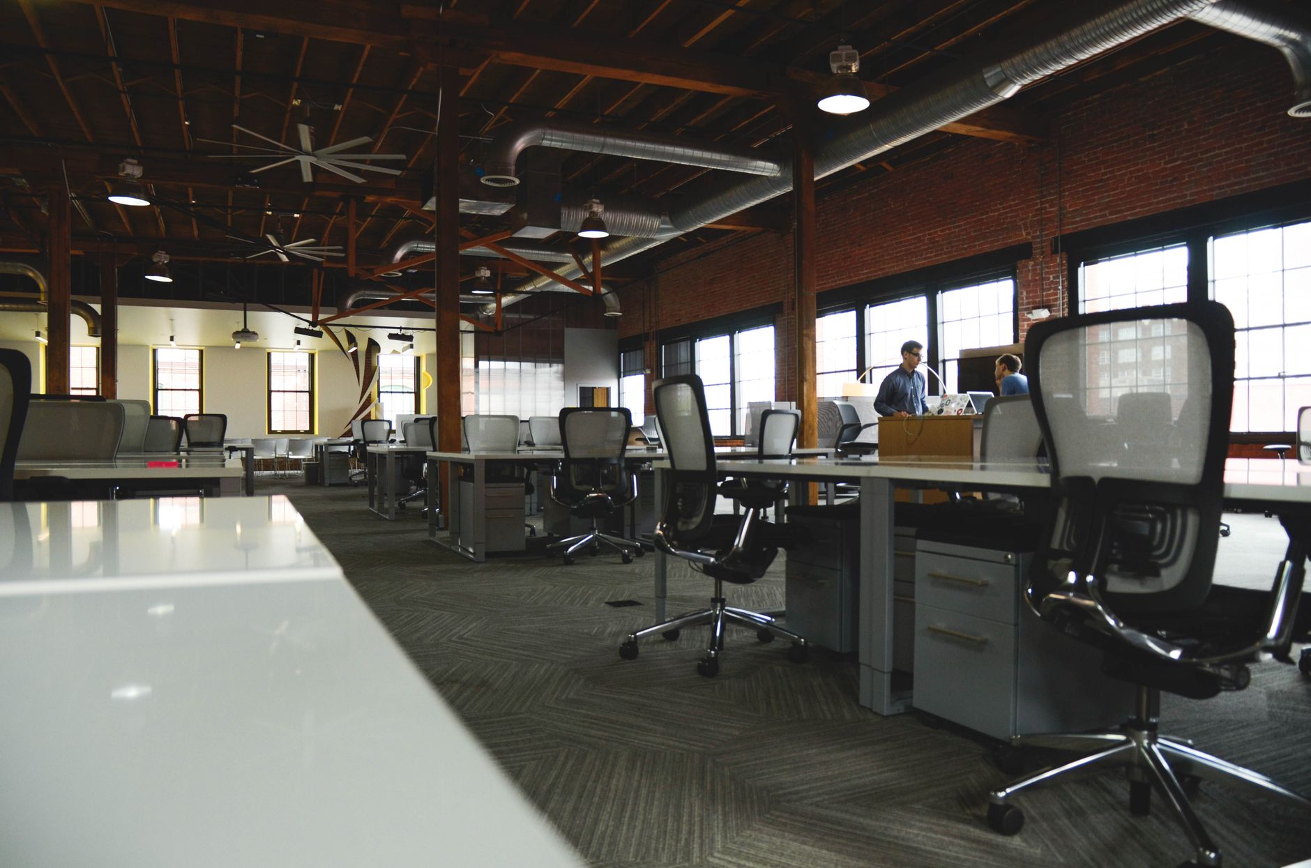Open-plan industrial coworking space with modern design and