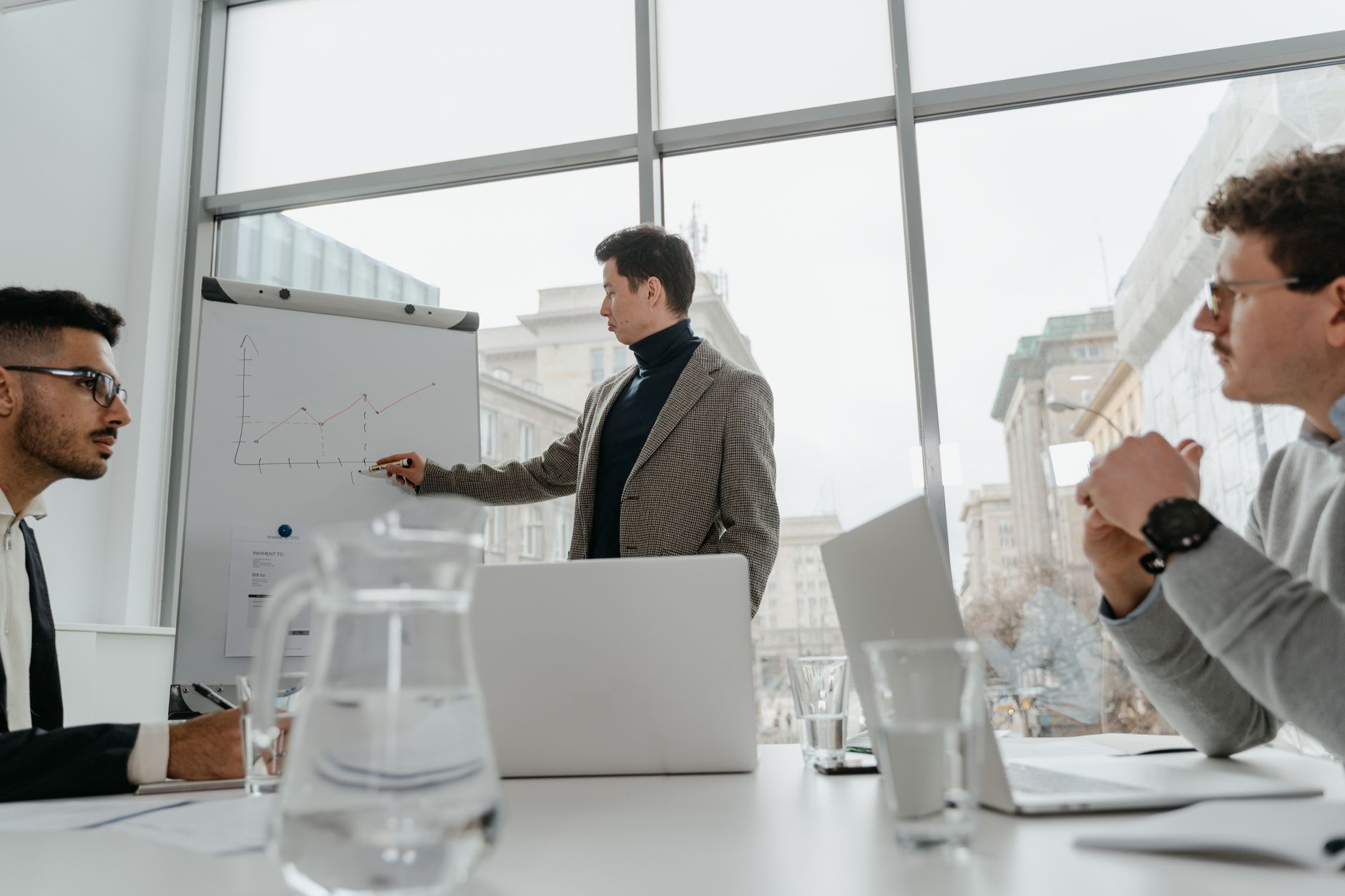 Professionals engaged in a collaborative business meeting wi