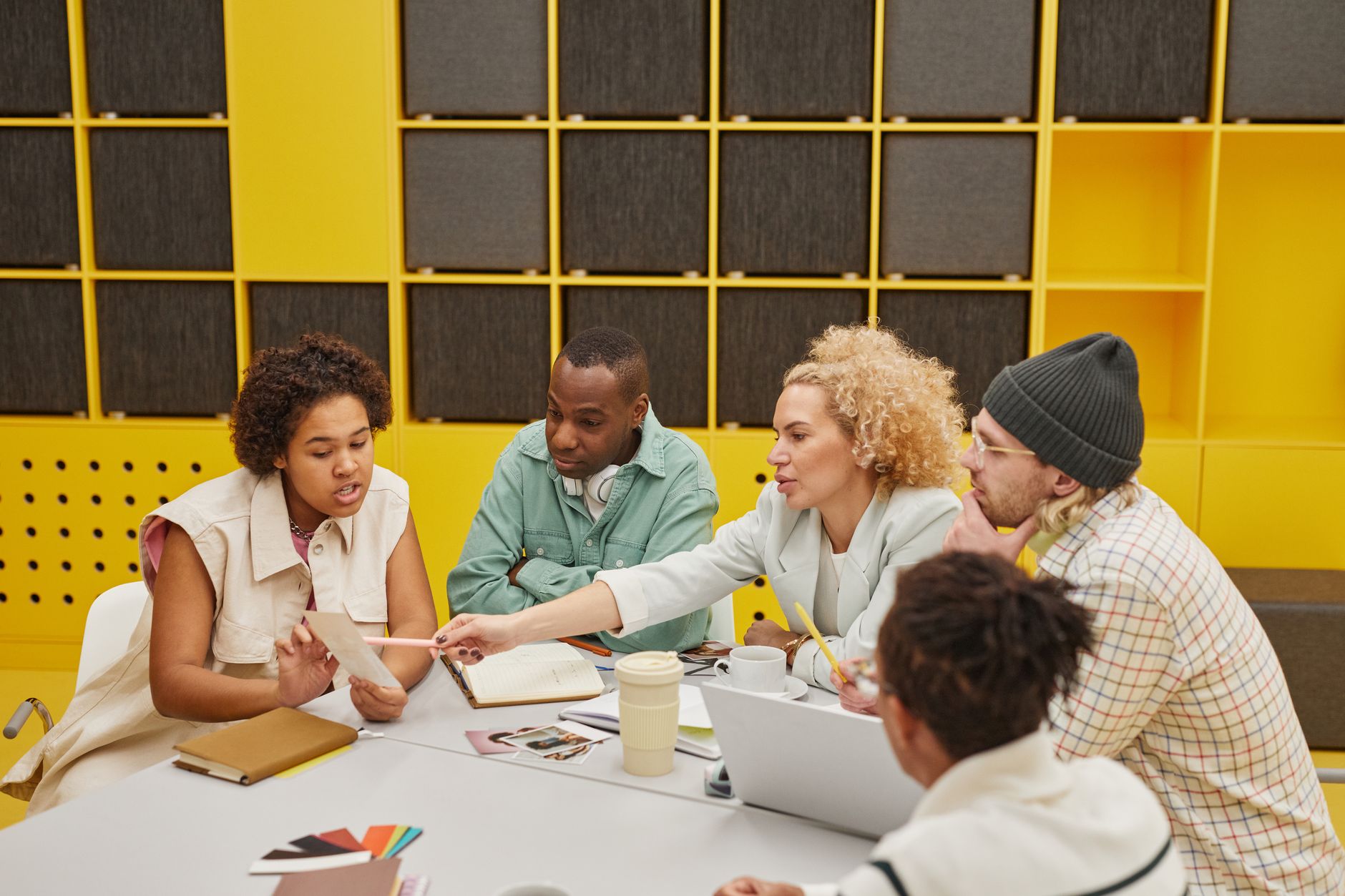A group of coworkers engaged in a collaborative meeting at a
