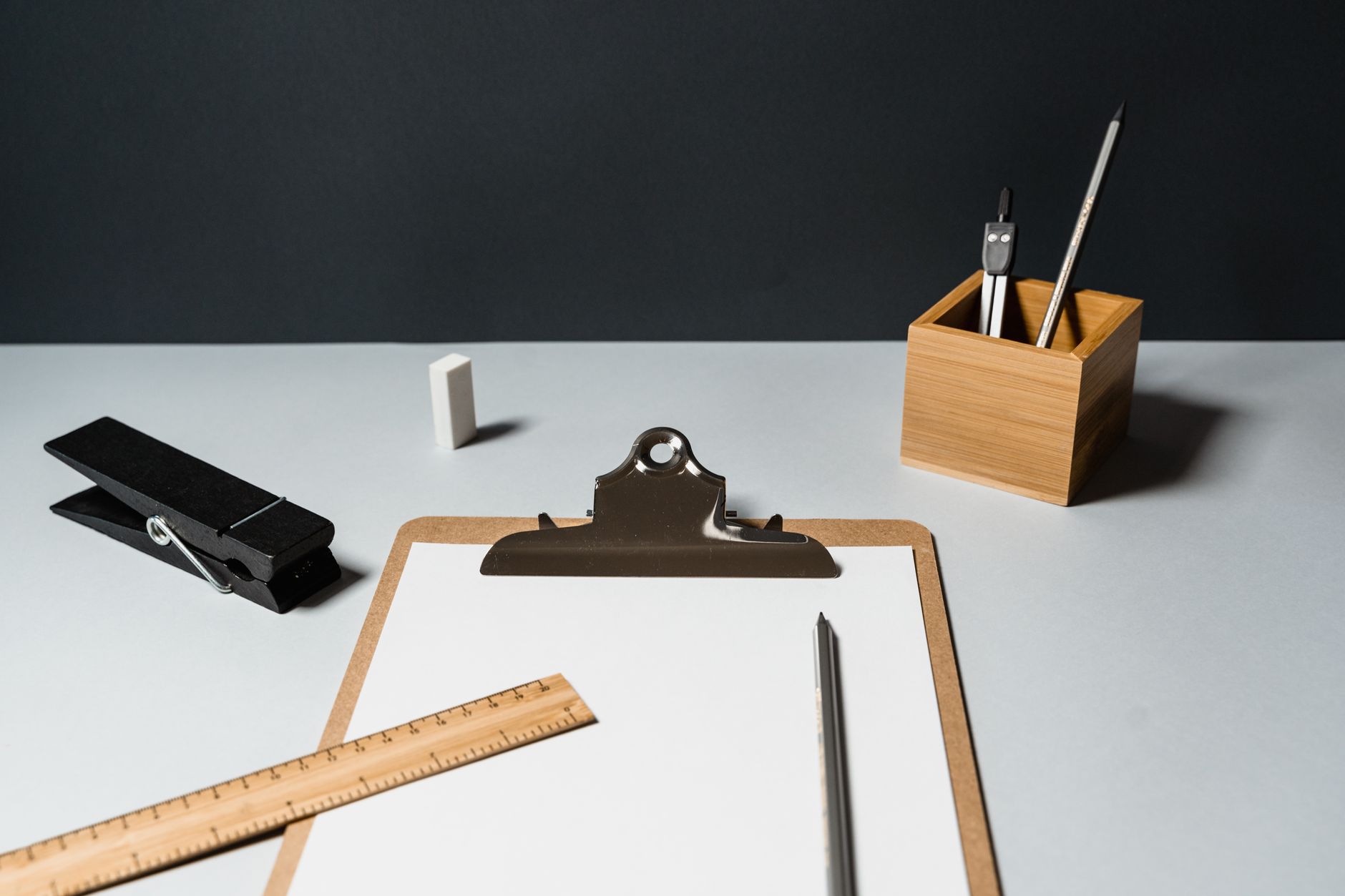 A minimalist office desk setup with essential office supplie