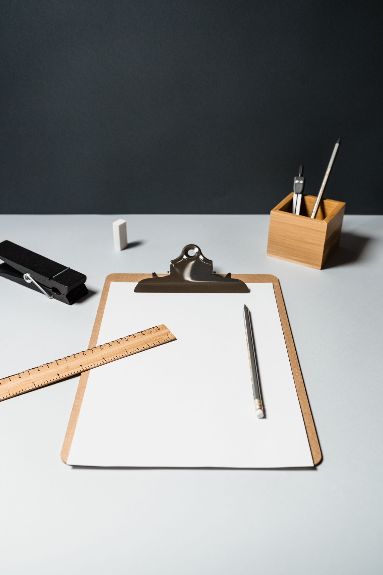 A neatly arranged display of office essentials on a white de