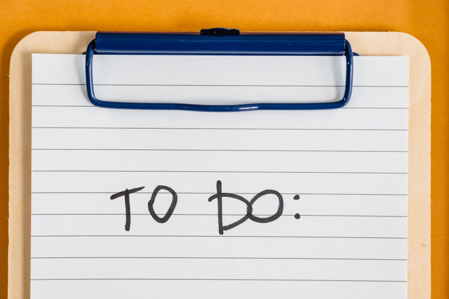 Clean and simple image of a to-do list on a clipboard with l