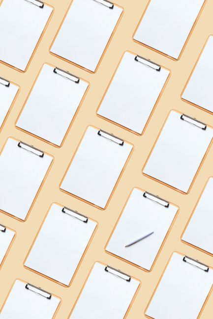 Flat lay of clipboards arranged in a pattern showcasing blan