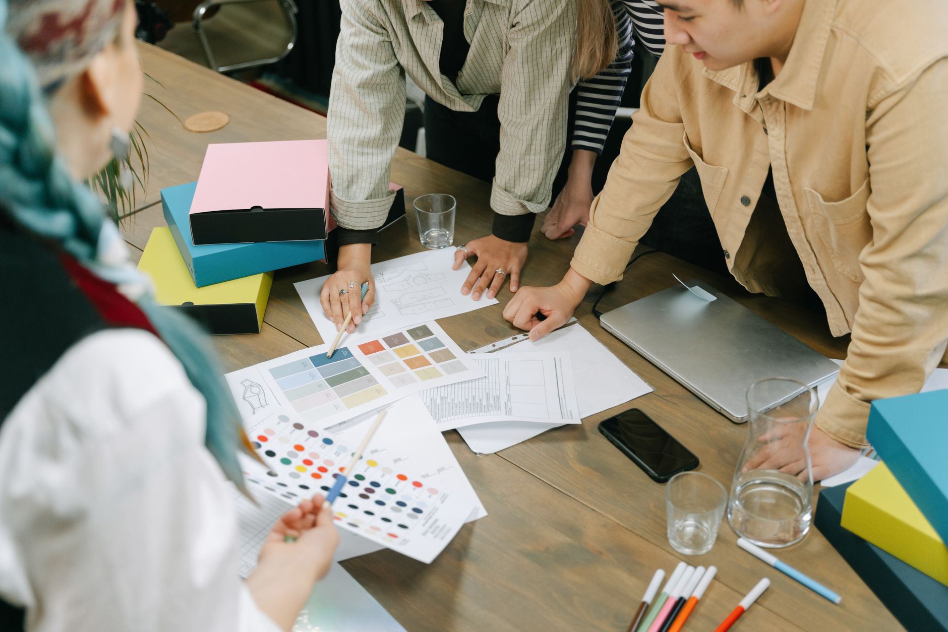 Creative professionals engaged in a design meeting, sharing
