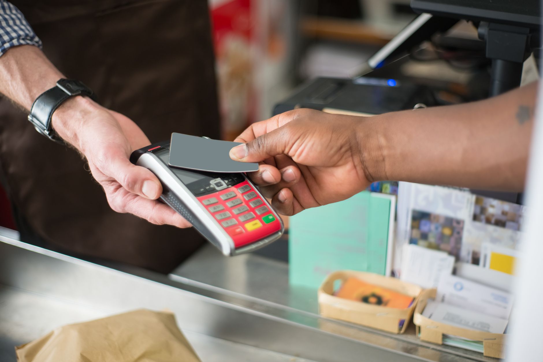 Close-up of a contactless payment transaction in a retail se