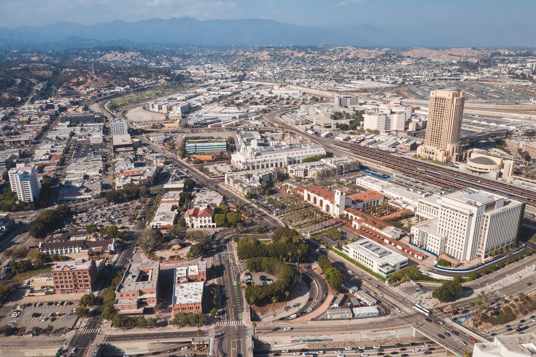 Aerial view capturing the vibrant cityscape of downtown Los Angeles, featuring iconic buildings and urban sprawl.